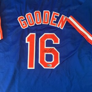 thejerseysourceautographsthejerseysourceautographs Doc Gooden New York Mets Signed New York Mets Green Majestic Jersey w/ 86 WS Champs- (JSA COA)