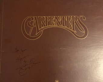 The Carpenters Karen & Richard Signed Autographed The Singles Record Album Vinyl  w/ Booklet and COA Rare Karen Signature