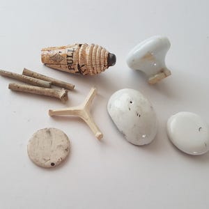 a group of ceramic objects found mudlarking, beachcombing, scotland,mudlarking finds remnants, crafts, mixed media