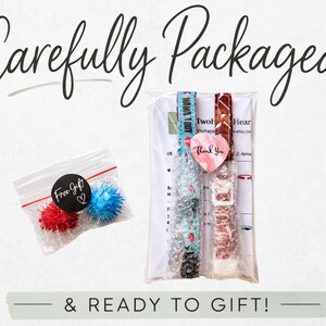 a carefully packaged gift with a note that says "Carefully Packaged & READY TO GIFT!" The gift includes a small bag of red and blue pom poms, a package of what appears to be a watch, and a note that says "Two Heart".