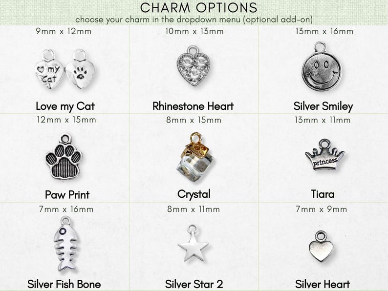 a variety of charms, including cat-themed charms, heart-shaped charms, and other decorative items.