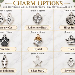 a variety of charms, including cat-themed charms, heart-shaped charms, and other decorative items.