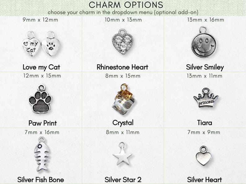 a variety of charms, including cat-themed charms, heart-shaped charms, and other decorative items.