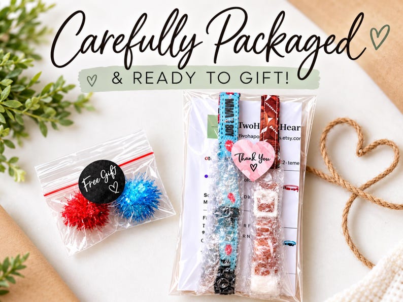 a carefully packaged gift with a note that says "Carefully Packaged & READY TO GIFT!" The gift includes a small bag of red and blue pom poms, a package of what appears to be a watch, and a note that says "Two Heart".