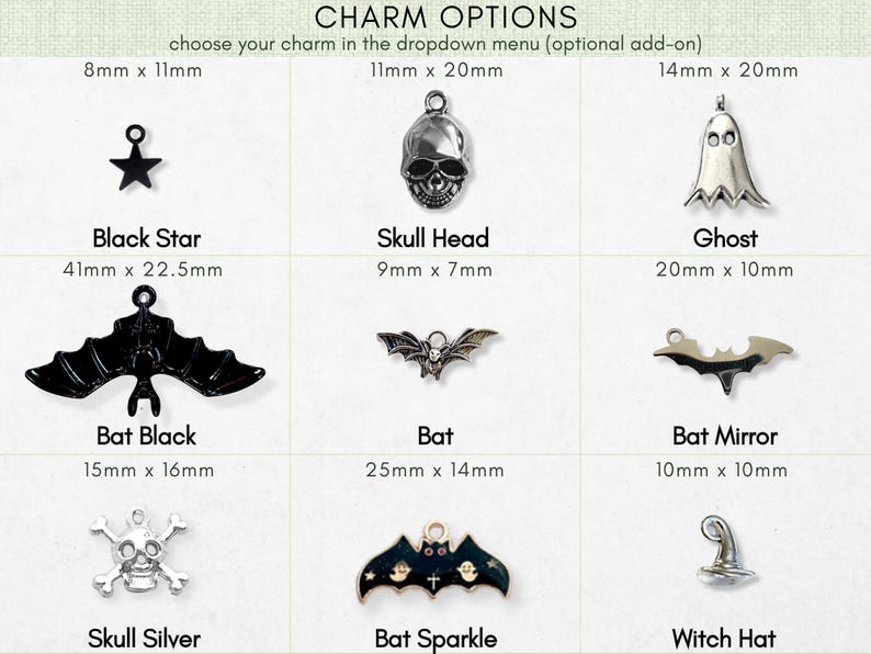 a collection of charms, including a skull, a ghost, a bat, a bat mirror, a skull silver, a bat black, a bat black, a bat mirror, a skull silver, a bat sparkle, and a witch hat.