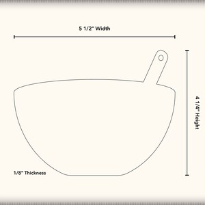 May include: A white ceramic bowl with a handle, measuring 5 1/2 inches wide and 4 1/4 inches high. The bowl is 1/8 inch thick.