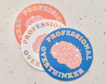 May include: Three round stickers with a brain graphic and the text "Professional Overthinker" in rainbow colors. The stickers are layered on top of each other.