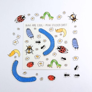 May include: A mini sticker sheet with colorful illustrations of various bugs, including ladybugs, ants, caterpillars, and a blue worm. The sheet also features small white flowers and the text "BUGS ARE COOL - MINI STICKER SHEET."