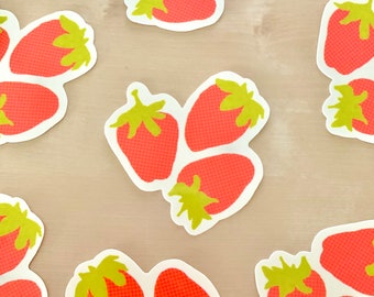May include: A set of ten red and green strawberry stickers. The strawberries are stylized with a textured pattern and have green leaves.