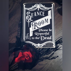 Seance room door sign