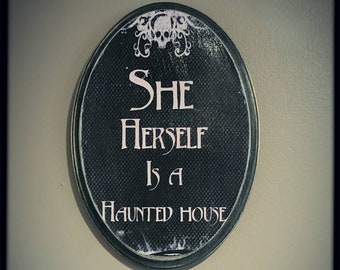 She herself is a haunted house plaque