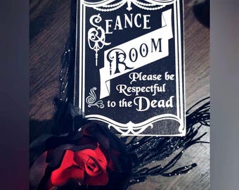 Seance room door sign