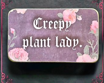 creepy plant lady box sign