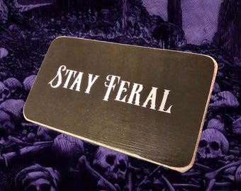 stay feral box sign