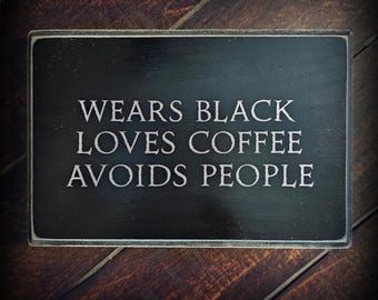 Wears black avoids people