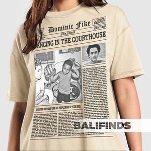 May include: A white ceramic mug with a black handle and the text "But First, Coffee" in a black, handwritten-style font. The mug is on a white surface.