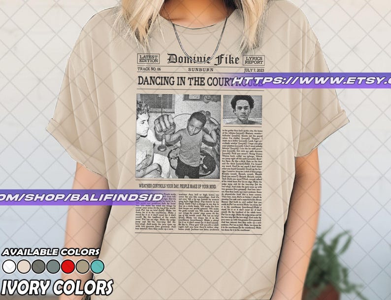 May include: Ivory-colored t-shirt featuring a newspaper-style graphic with the text "Dominie Fike" and "Dancing in the Court." The graphic includes black and white images and text. Available in multiple colors.