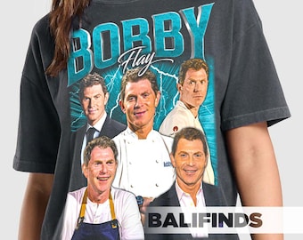May include: Dark gray t-shirt featuring a graphic of Bobby Flay with the name "BOBBY FLAY" in teal block letters. The shirt has multiple images of Bobby Flay in various poses. The word "BALIFINDS" is printed in white at the bottom.