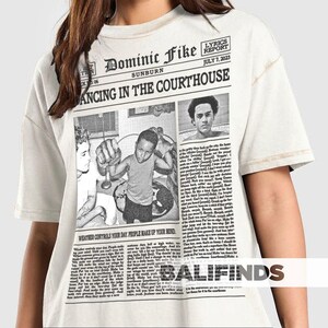 May include: A white ceramic mug with a black handle and the text "But First, Coffee" in a black, bold font. The mug is sitting on a white surface. The mug is approximately 4 inches tall.