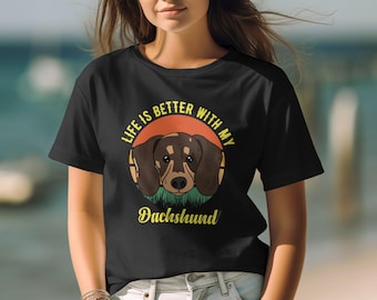 May include: Black t-shirt with a retro-style graphic of a dachshund dog. The text "Life is better with my Dachshund" is printed in yellow on the shirt.