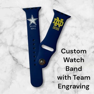 May include: Two blue silicone watch bands with custom embroidery. One band features a white star with the text "We Dem Boyz" and the other band features a gold Notre Dame logo with the text "Irish".