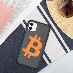 May include: A black phone case with a bright orange Bitcoin symbol on the back. The case is made of a textured material and has a camera lens cutout.