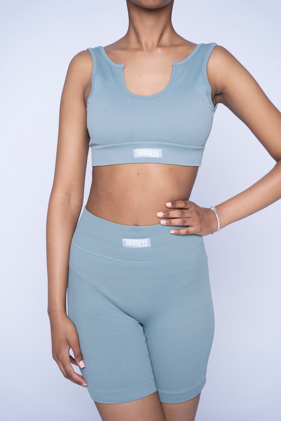 Fitness in Style: the Ultimate Light Blue Sports Set With Biker