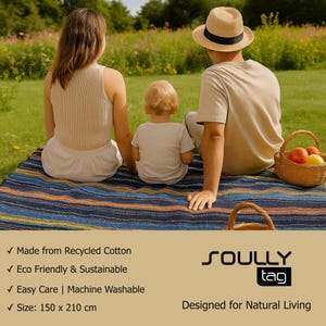 May include: A rectangular woven picnic blanket featuring horizontal stripes in shades of blue, orange, and yellow. The blanket measures 150 x 210 cm and is made from recycled cotton. The text SOULLY tag is printed in black on a tan background.