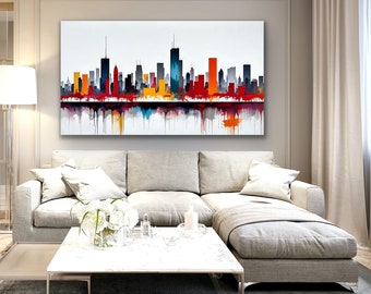 Puede incluir: Pintura abstracta de un horizonte urbano en tonos de rojo, naranja, amarillo, azul y negro. La pintura se muestra en una pared sobre un sofá seccional gris con almohadas blancas.