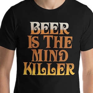 May include: Black t-shirt with a yellow and orange graphic that reads "Beer is the mind killer."