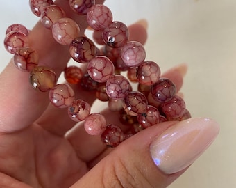 Pulsera sanadora emocional de ágata veteada de dragón con cristales para sanación.