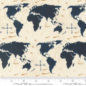 May include: A beige fabric with a repeating pattern of navy blue world maps, compass roses, and small gold fish. The fabric has a subtle linen texture.