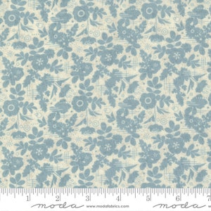 May include: A blue and white floral fabric with a repeating pattern of stylized flowers and leaves. The fabric has a subtle texture and a vintage feel.