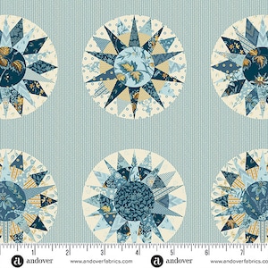 May include: A blue and white fabric with a repeating pattern of starburst designs. The fabric features a variety of blue and yellow floral patterns within each starburst. The fabric is lined with a blue and white striped pattern.