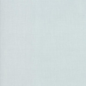 May include: A solid light blue fabric with a visible woven texture. The material features a consistent, fine grid-like pattern created by the interlacing of horizontal and vertical threads, resulting in a matte finish across the entire surface.