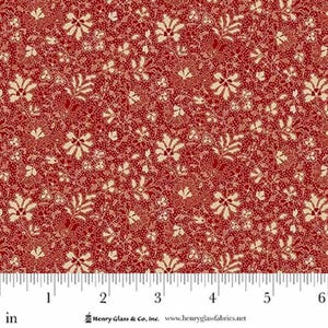 May include: Red fabric with a repeating floral pattern in cream and red. The design features stylized flowers and leaves, with a dotted background. The fabric is measured in inches.