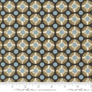 May include: Fabric with a repeating pattern of circles and dots. The circles feature a starburst design in tan, cream, and light blue, set against a dark brown background. Light blue dots fill the spaces between the larger circles. The fabric is marked with a ruler.