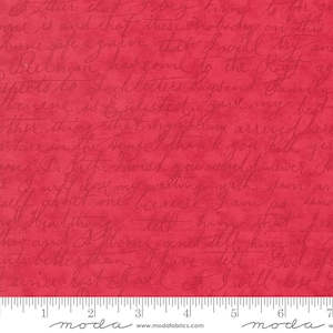 May include: Red fabric with a white handwritten pattern of cursive script. The fabric has a textured surface and a ruler with the word "moda" printed on it.