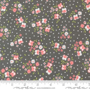May include: A gray fabric with a white polka dot pattern and a repeating floral design in pink and white.