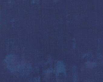 May include: A solid blue textured background with a slightly faded appearance.