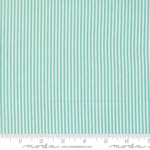 May include: A white fabric with thin, teal blue stripes. The fabric is measured in inches.