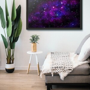 May include: A framed print of a galaxy with a purple and blue nebula and white stars against a black background.