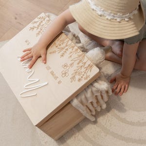 Baby memory box as a birth gift with name and dates and a flower meadow