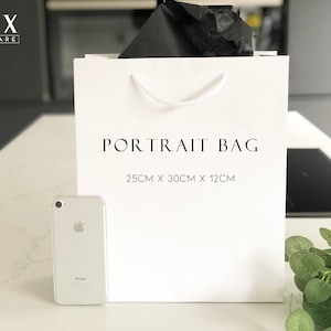 May include: White paper gift bag with black text that reads "PORTRAIT BAG 25CM X 30CM X 12CM" and the brand name "LUX HOMEWARE" in the top left corner.
