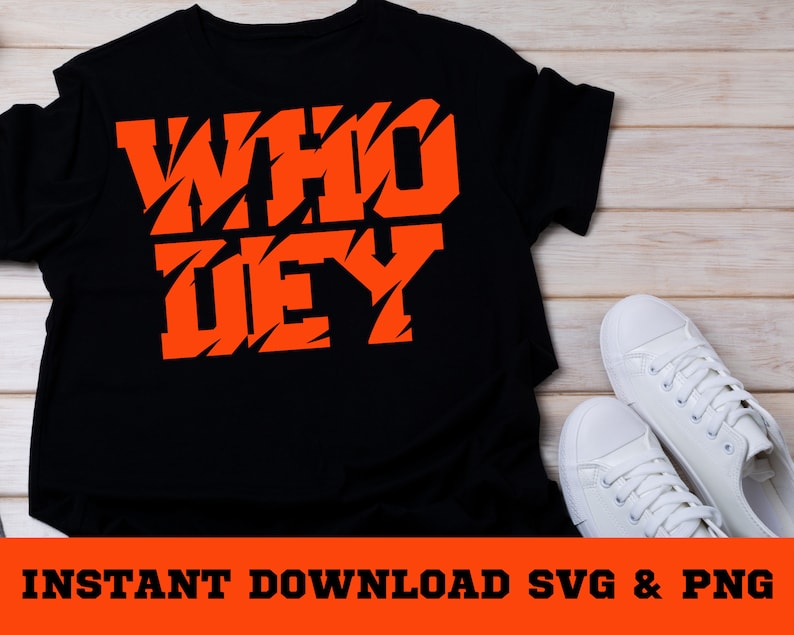 Peut inclure: T-shirt noir avec les mots "WHO DEY" en orange, imprim&eacute;s dans une police de caract&egrave;res dentel&eacute;e.