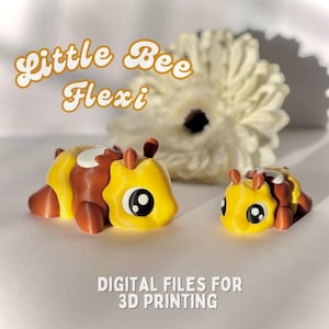 May include: Two 3D printed bee figurines, one larger than the other. The larger bee is brown and yellow with black eyes. The smaller bee is yellow with black eyes. The text "Little Bee Flexi" is in the background.