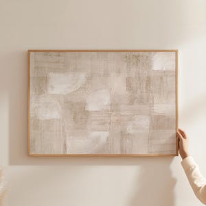 May include: A rectangular wall art piece featuring an abstract composition in shades of beige, cream, and white. The surface displays a textured grid pattern with layered brushstrokes and semi-circular arcs, all enclosed within a light wood frame.