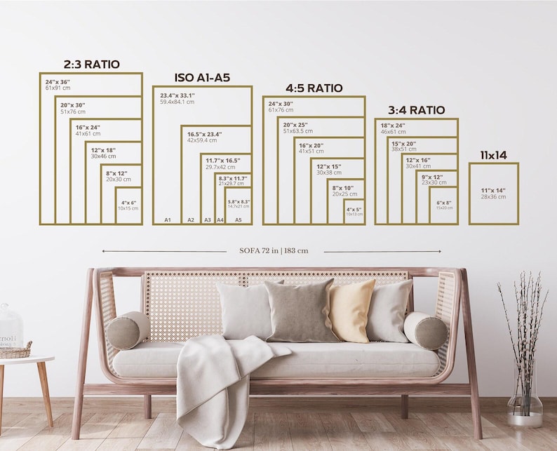 May include: A wall display showing print sizes and ratios, including 2:3, ISO A1-A5, 4:5, 3:4, and 11x14. Sizes are shown in inches and cm. A sofa, 183 cm wide, is positioned below the display.