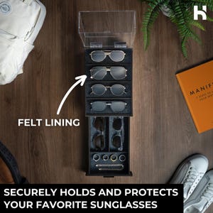 May include: A vertical black storage organizer with a clear hinged lid and a pull-out drawer. The interior features grey felt lining, four upper slots for sunglasses, and lower compartments for additional eyewear and small jewelry items.