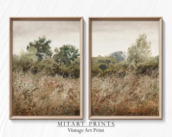May include: A pair of vintage art prints depicting a landscape scene with trees and fields in muted green, brown, and white tones. The prints are framed in a light wood frame.